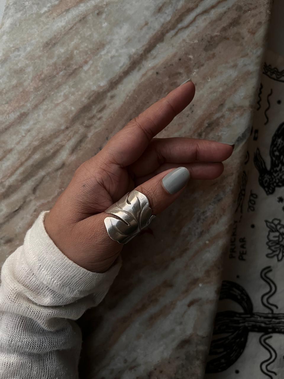 Handcrafted silver wrap ring with maple leaf design  