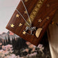 Horse silver pendant on a decorative gift box with stars, highlighting unique handmade gifts.