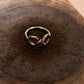 Handicrafts silver ring featuring infinity symbol twist