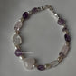 Handcrafted silver bracelet featuring rose quartz heart charm