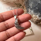 Handcrafted Silver Necklace with Moon and Floral Details  