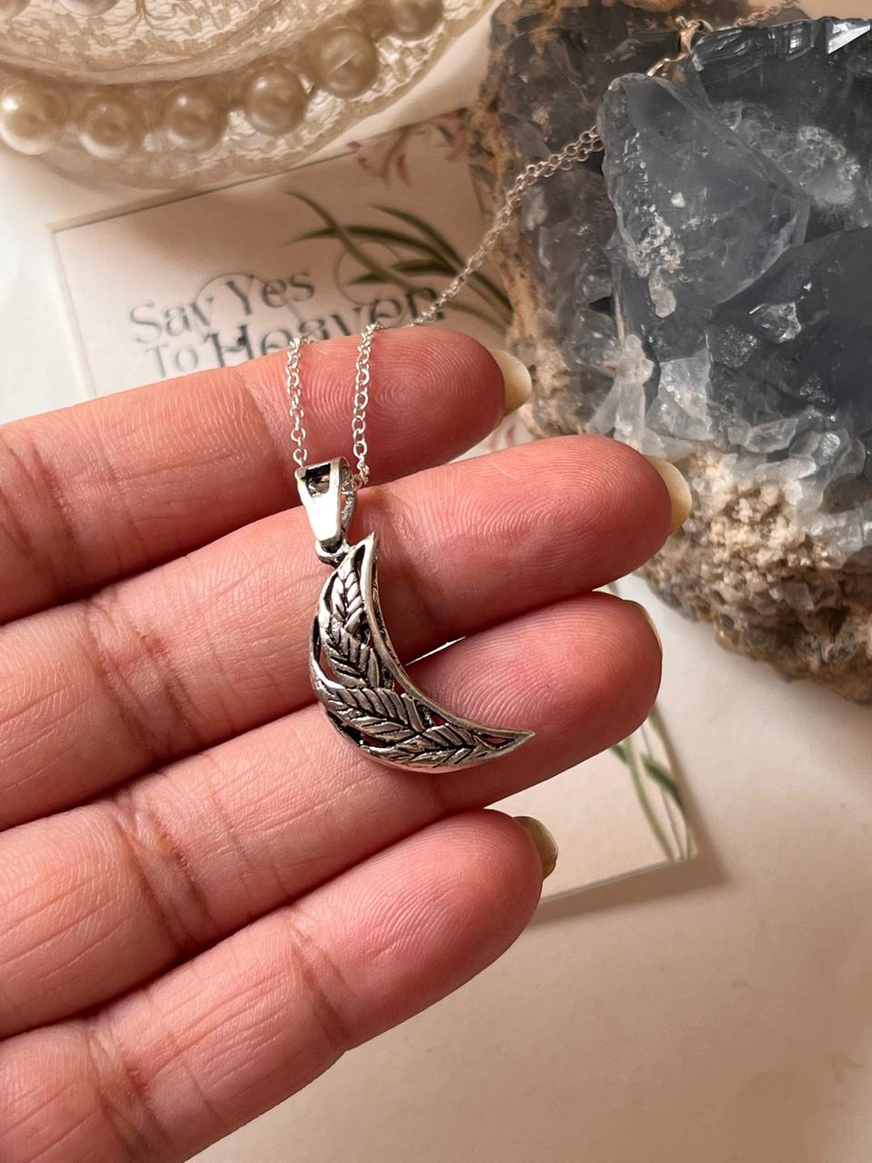 Handcrafted Silver Necklace with Moon and Floral Details  