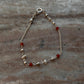 Red and white beaded anklet in sterling silver