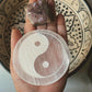 Handcrafted selenite charging plate featuring Yin Yang