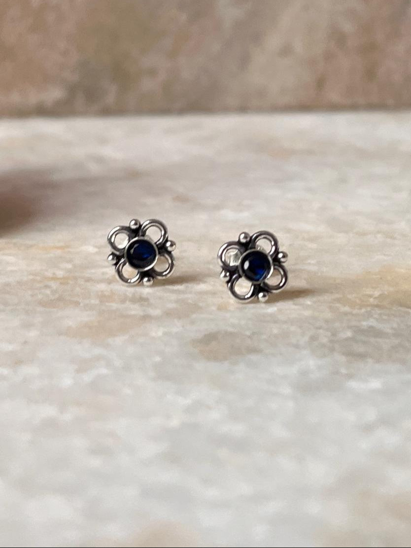 Elegant flower design sterling silver earrings with blue CZ stones  