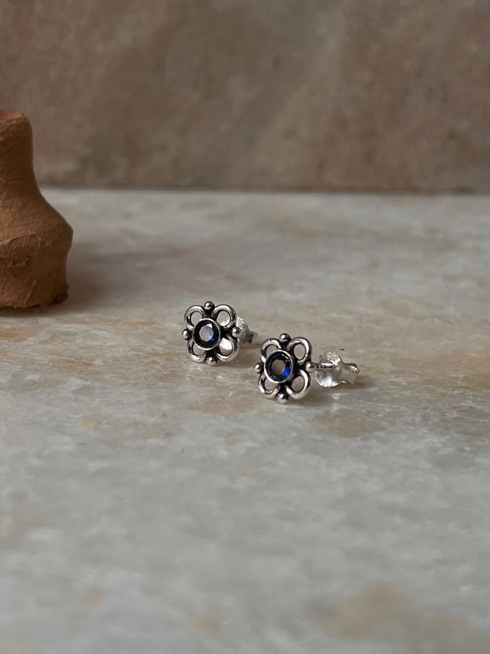 Designer sterling silver flower earrings with blue CZ design