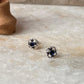 Classic sterling silver floral studs with blue CZ sparkle