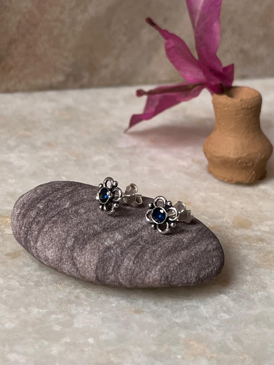 Stylish sterling silver flower earrings with blue CZ stones
