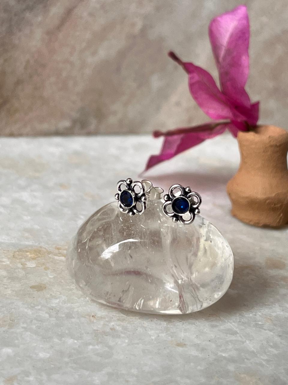 Handcrafted sterling silver flower earrings with blue cubic zirconia  