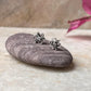 Handcrafted silver flower studs with white cubic zirconia  