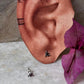 Ethnic rawa design sterling silver studs with pink cubic zirconia