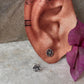 Stylish sterling silver floral studs with white CZ sparkle