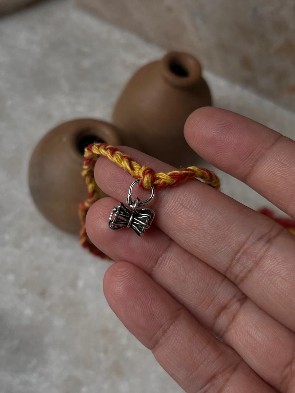 Sterling Silver Rakhi with Shiv Damru Pendant  