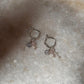Elegant silver hoops featuring rose quartz and floral silver beads  