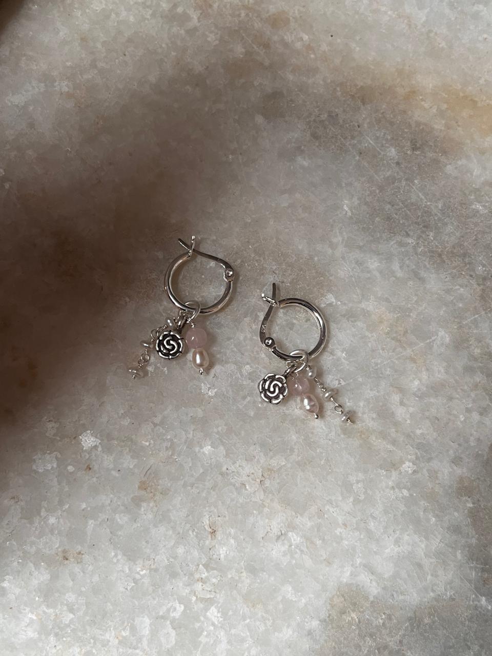Elegant silver hoops featuring rose quartz and floral silver beads  