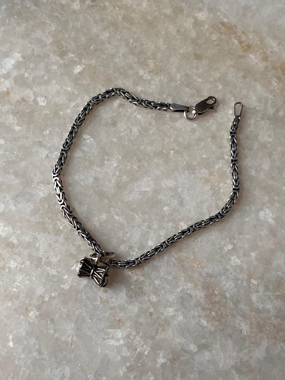  Small Damru rakhi in antique silver finish  