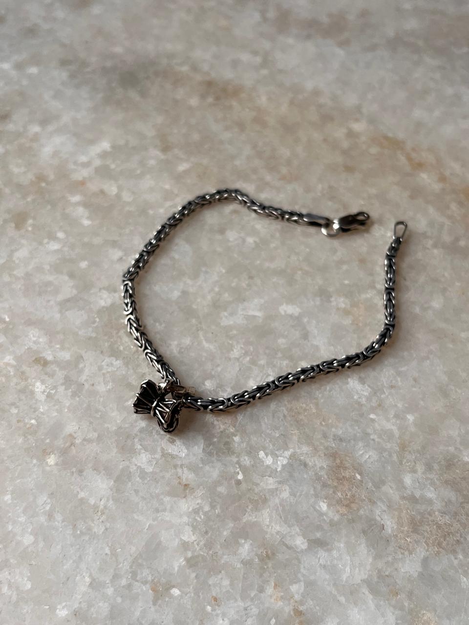 Antique patterned Shiva Damru silver rakhi  