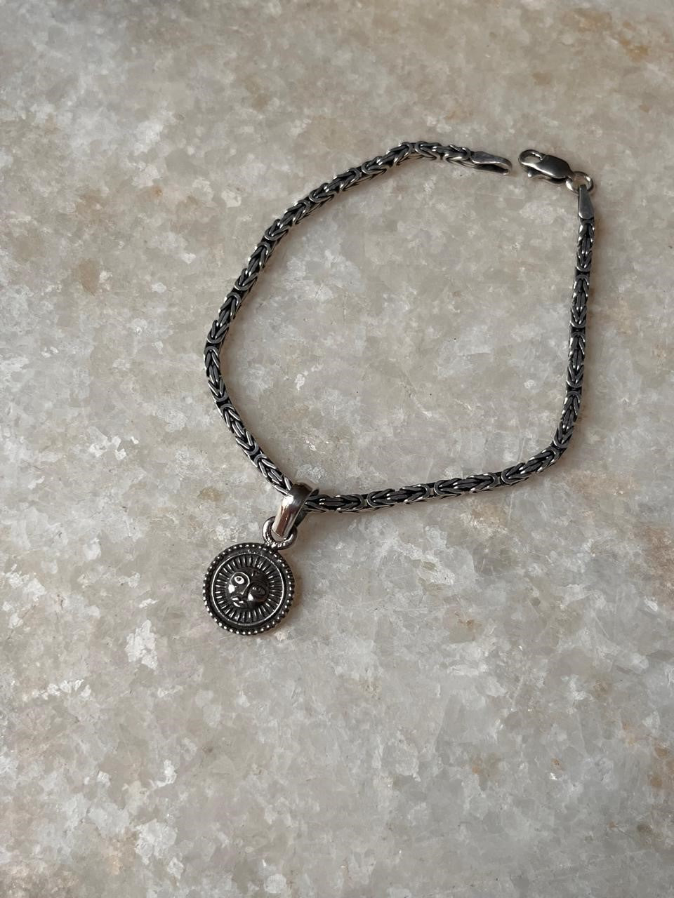 Handcrafted Surya rakhi in sterling silver  