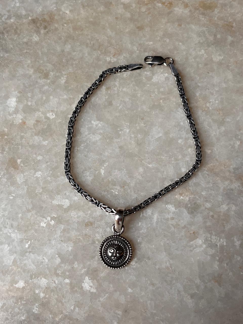 Sun symbol rakhi in antique silver finish