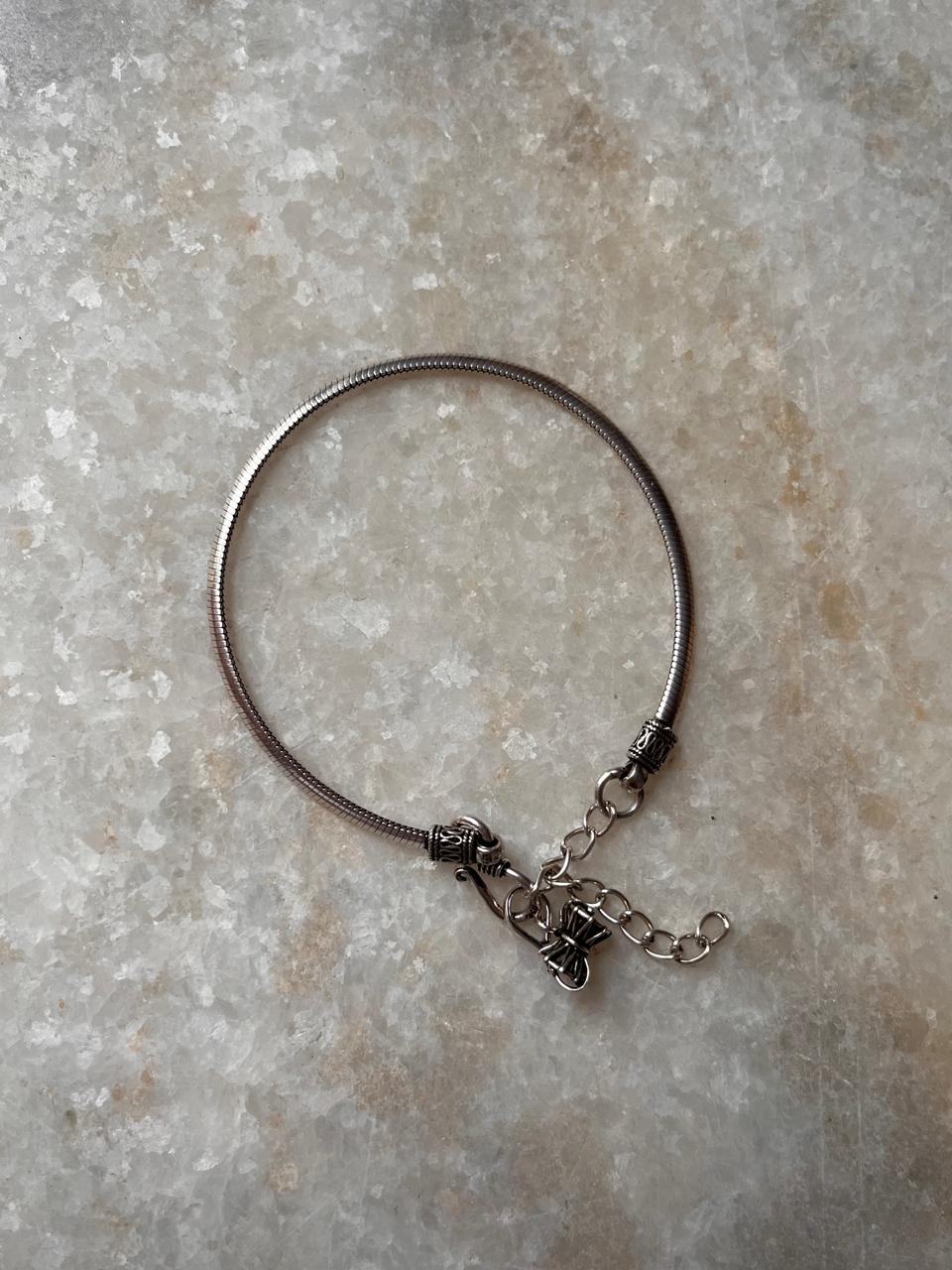 925 sterling silver rakhi featuring flat snake and Damru design  