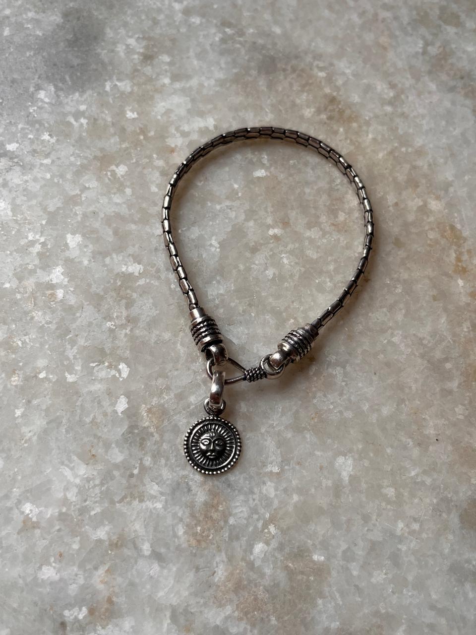 Sun symbol rakhi with snake design in sterling silver