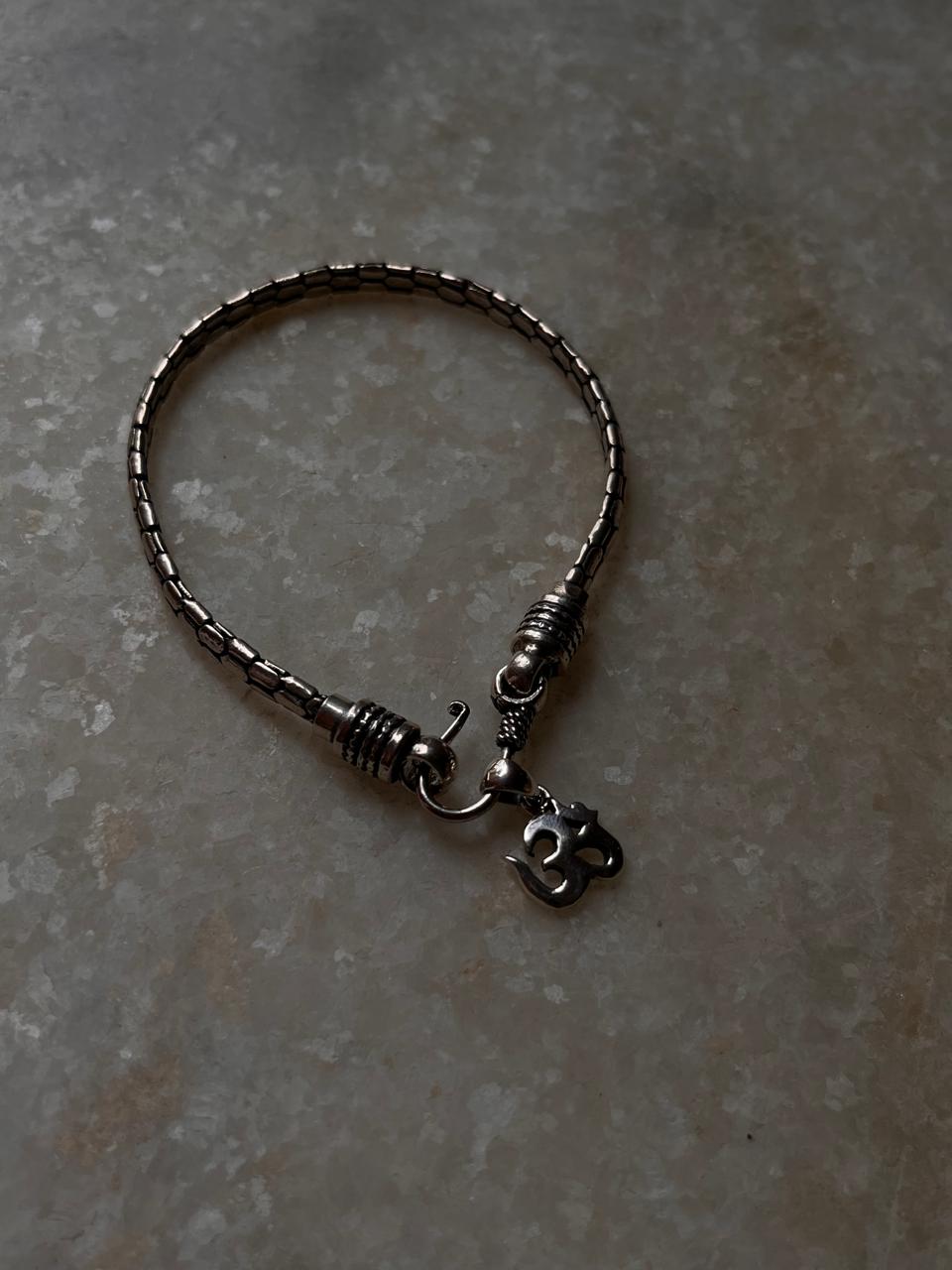 925 sterling silver rakhi featuring plain Om and snake motif  