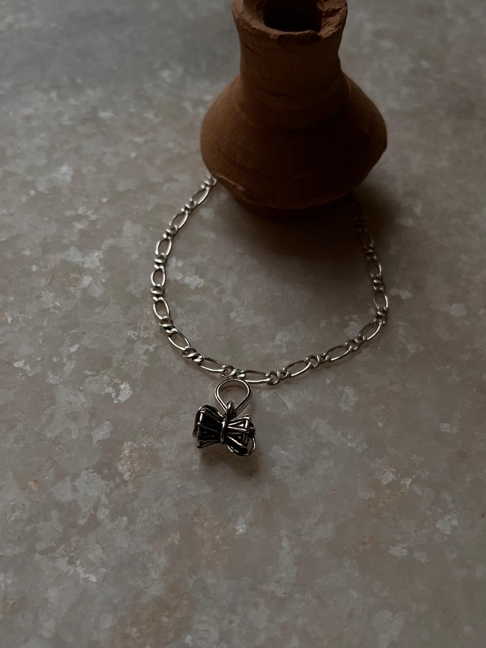 Figaro chain rakhi with small Shiva Damru in 925 silver  