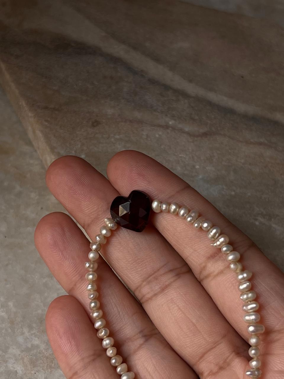 Handcrafted Basra pearl bracelet with garnet heart 