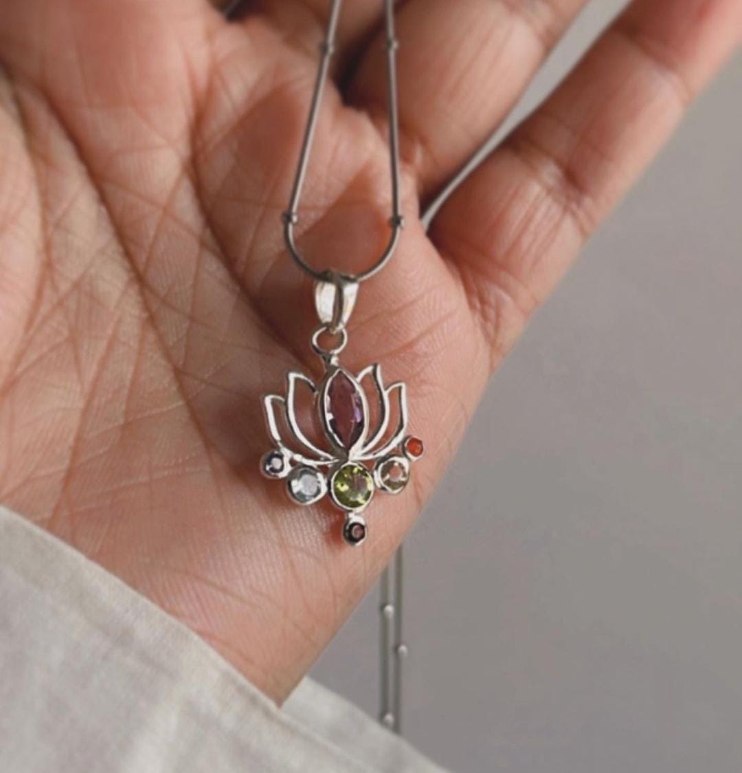 Sterling silver pendant featuring lotus design and seven chakra stones
