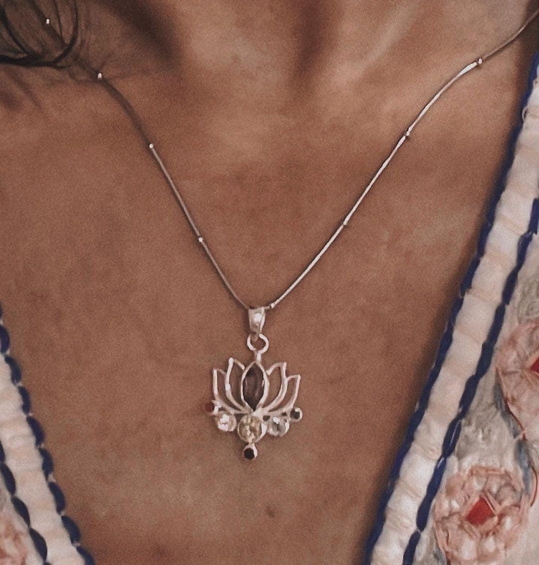 Timeless silver pendant with lotus symbol and seven chakra stones