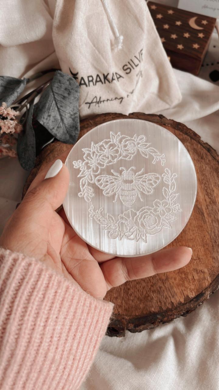 Bee-themed selenite charging plate for crystal cleansing