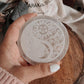 Sacred selenite plate for crystal recharging with Yin Yang, Moon, and Sun symbols