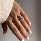 Handcrafted adjustable silver ring with leafy pattern