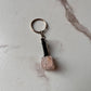 Handcrafted rose quartz key ring with polished finish