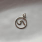 Elegant round silver pendant with wave design