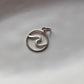 Sleek wave pattern in round silver pendant