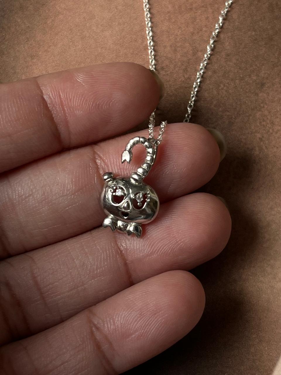 Close-up of crab 2 silver necklace with a detailed crab design