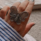 Bold silver 925 ring featuring a large butterfly design with delicate filigree.