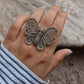 Exquisite butterfly design silver ring featuring detailed filigree work.