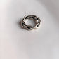 Adjustable handcrafted silver ring with a chunky twisted braided pattern