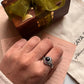 Silver ring with a round amethyst stone, perfect for boho style.