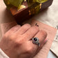 Unique round amethyst ring in a boho silver setting.