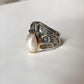 Timeless rustic 2 silver ring showcasing two beautiful Baroque pearls.