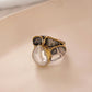 Elegant silver ring with two Baroque pearls in a rustic design.