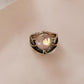 Vintage-inspired rustic silver ring featuring a pair of Baroque pearls.