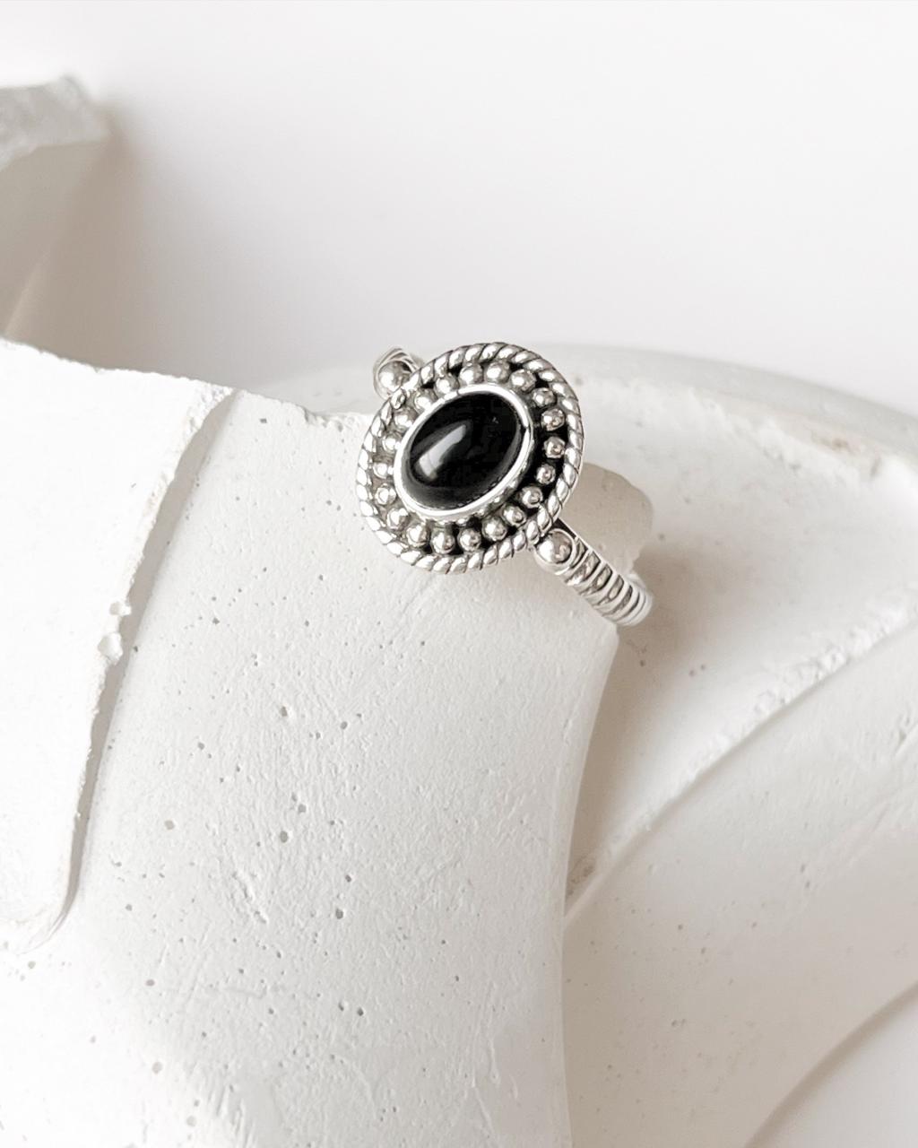 Black Onyx Rawa Tribal Silver Ring with ornate silver detailing, displayed on a neutral background.