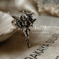 Elegant angel-themed adjustable ring in polished silver.