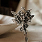 Charming silver adjustable ring with angel wings design.