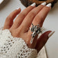 Beautiful sterling silver ring with an adjustable band and angel motif.