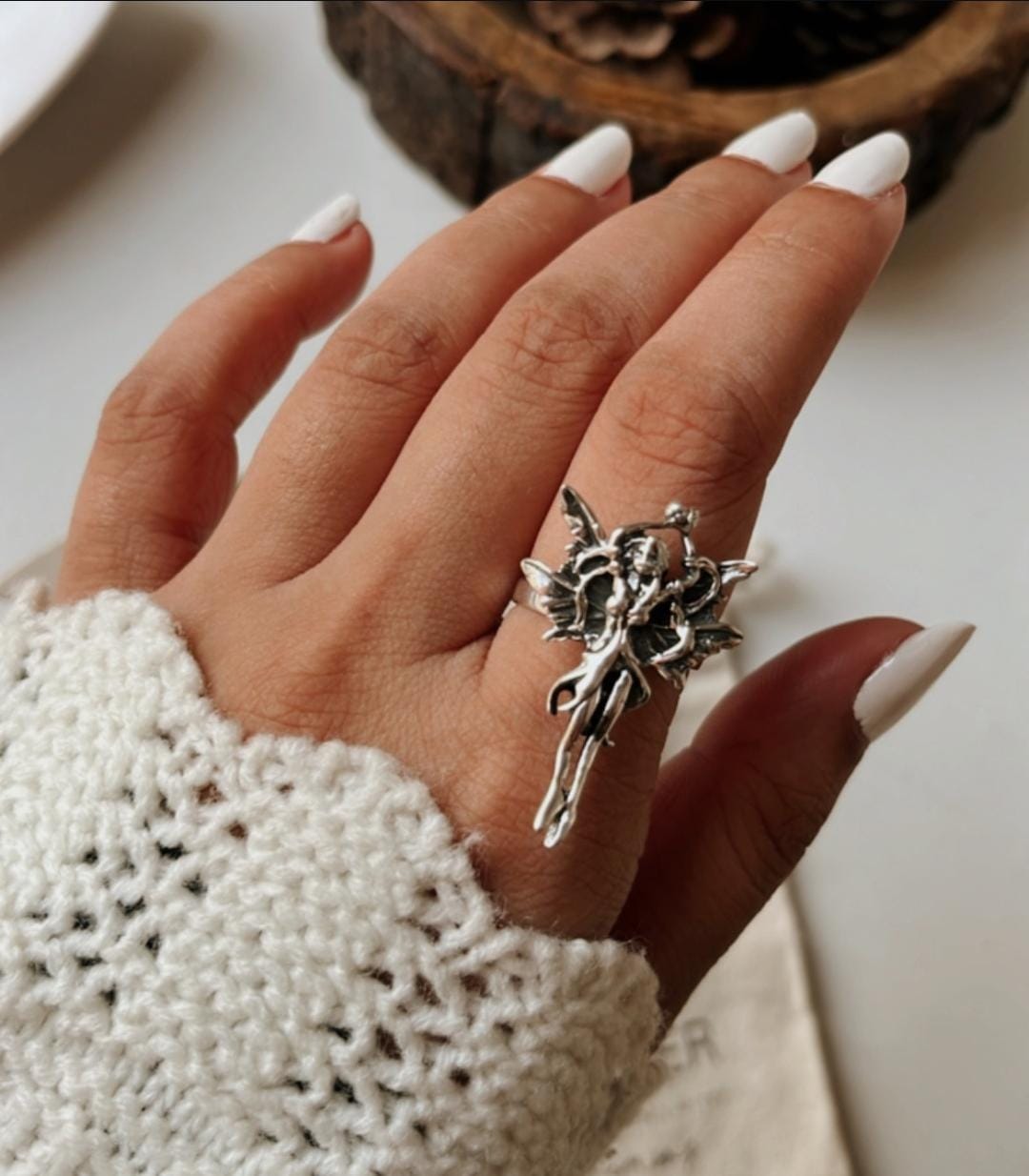 Beautiful sterling silver ring with an adjustable band and angel motif.